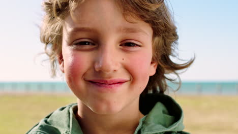 Face,-smile-and-kid-at-beach-park-on-vacation