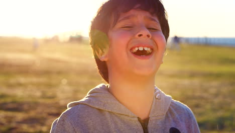 Child,-laughing-and-face-with-a-boy-laughing-alone