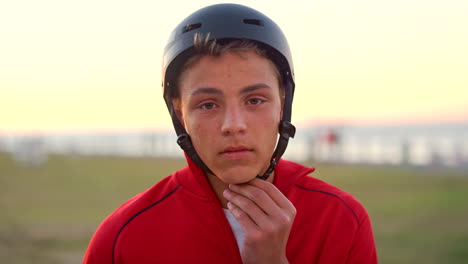 Face,-boy-or-teenager-helmet-in-sunset-nature