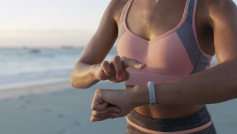 Beach,-running-and-woman-smartwatch-for-fitness