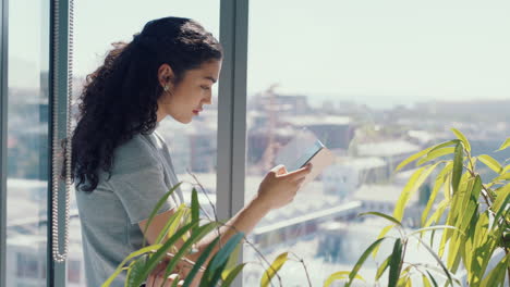 Smartphone,-window-and-business-woman-in-office