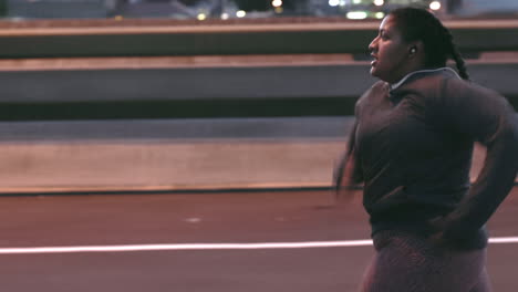 Fitness,-night-and-black-woman-running-in-the-city
