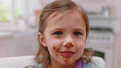 Messy,-chocolate-and-face-of-girl-in-kitchen