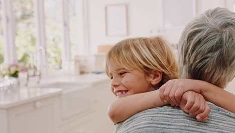 Child,-smile-and-hug-grandmother-in-kitchen