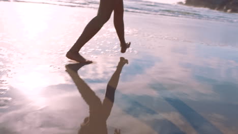 Woman-feet,-beach-and-walking-on-sand