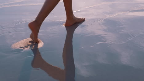 Woman,-feet-and-walking-on-beach