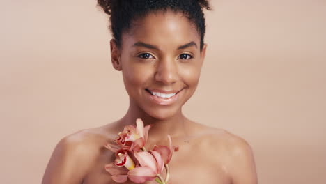 Black-woman,-face-and-flower-in-beauty-skincare
