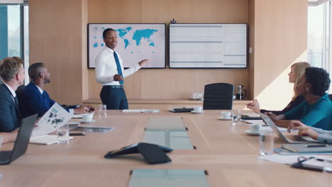Black-man,-office-and-meeting-in-presentation