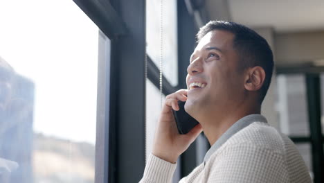 Phone-call,-smile-or-businessman-in-office-window