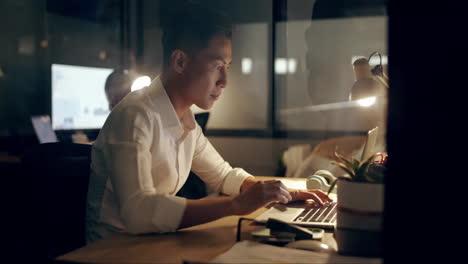 Asian-businessman,-laptop-and-phone-at-night