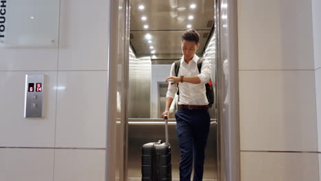 Elevator,-travel-and-watch-with-a-business-asian