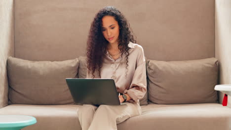 Computer,-working-and-sofa-with-a-black-woman