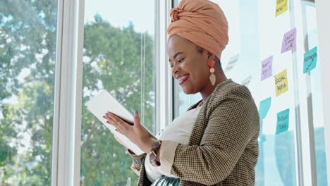 Laughing,-black-woman-and-tablet-of-a-business