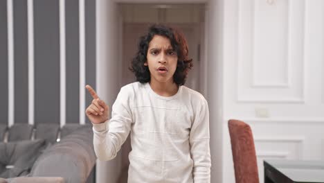 Unhappy-Indian-kid-waving-No-to-the-camera