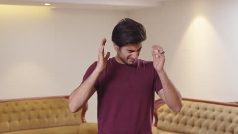 Indian-man-suffering-from-a-headache