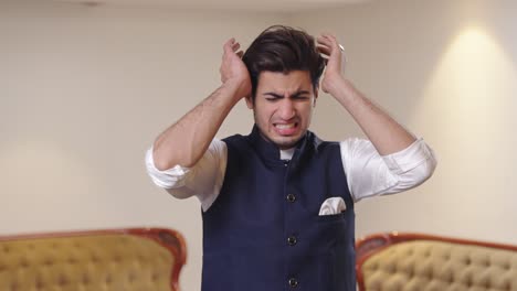 Indian-man-having-a-severe-headache