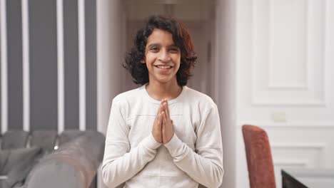 Indian-teenager-kid-boy-doing-Namaste-as-greetings