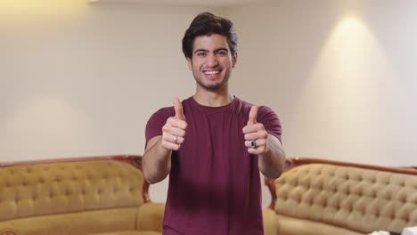 Happy-Indian-man-showing-thumbs-up-to-the-camera
