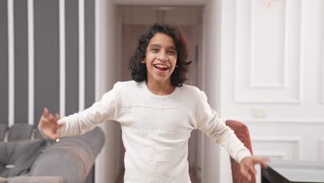 Happy-and-energetic-Indian-kid-boy-waving-Hello-towards-the-camera