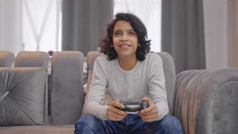 Happy-Indian-kid-boy-playing-video-games