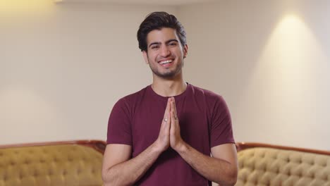 Happy-Indian-man-doing-Namaste-with-a-big-smile
