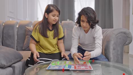Indian-kid-boy-scraps-the-Ludo-game-when-sister-is-about-to-win