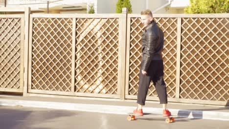Young-man-rides-on-his-longboard-in-the-city