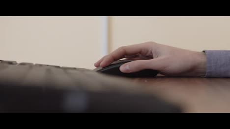 Hand-clicking-computer-mouse