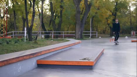 Hipster-skateboarder-riding-and-jumping-in-a-skatepark.-Slow-Motion-shot