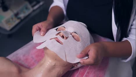 Professional-carboxytherapy-for-young-woman-in-spa-salon.-Close-Up-view-of-professional-cosmetologist-applying-special-mask-on