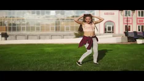 Young-hipster-woman-with-dreads-turning-cartwheels-in-a-park-during-a-bright-sunny-summer-day.-Slow-Motion-shot