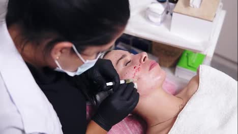 Rejuvenating-procedures:-professional-cosmetologist-makes-multiple-injections-in-woman's-face-skin-during-mesotherapy