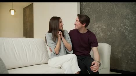 Happy-couple-with-keys-from-their-new-house,-a-man-surprised-wife-with-a-new-apartment