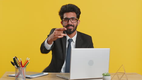 Indian-businessman-looking-at-camera-doing-phone-gesture-says-hey-you-call-me-back-make-conversation