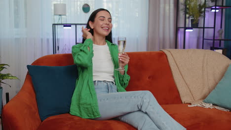 Joyful-woman-drinking-champagne-celebrate-success-win,-career-grow-up,-lucky-purchase-of-new-house