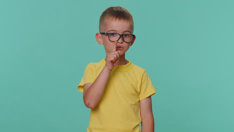 Toddler-children-boy-presses-index-finger-to-lips-makes-silence-gesture-sign-do-not-tells-secret