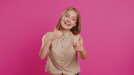Young-woman-raises-thumbs-up-agrees-or-gives-positive-reply-recommends-advertisement-likes-good-idea