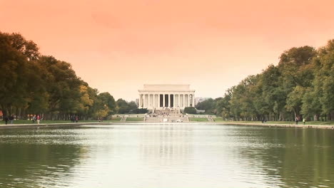 A-long-shot-of-the-Lincoln-Memorial-across-the-reflecting-pool-with-ducks-swimming-past-2