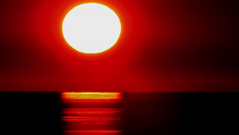 Time-lapse-of-a-huge-orange-sunset-ball-setting
