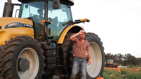 A-handsome-farmer-stands-aside-his-tractor-2