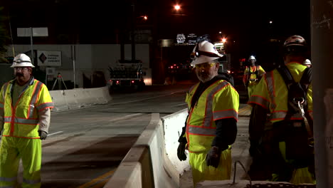 American-workers-build-road-infrastructure-at-night