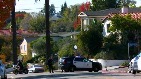 Police-redirect-traffic-in-an-urban-neighborhood-