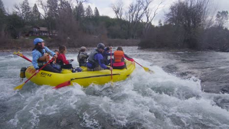 Rafters-paddle-through-rapids-on-a-river