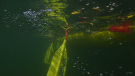 Underwater-view-of-oars-pulling-through-the-water