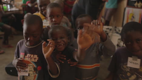 African-children-wave-at-the-camera