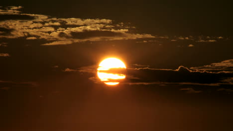 A-glowing-orange-sky-darkens-as-the-sun-slips-below-the-horizon
