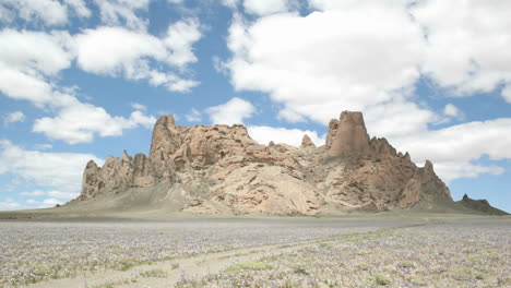 Fluffy-white-clouds-pass-over-New-Mexico's-Shiprock