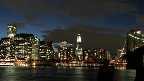 Slow-pan-of-a-timelapsed-view-of-the-Brooklyn-Bridge-and-the-New-York-City-skyline-from-goldenhour-to-night