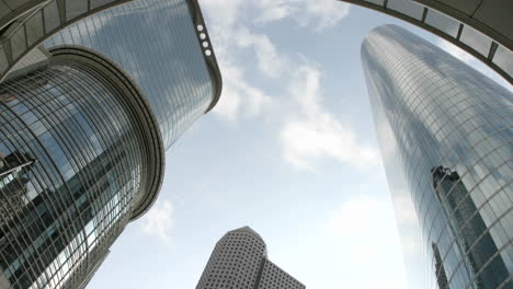 Slow-upward-pan-of-the-Houston-Oil-Company-Buildings-seen-from-beneath-an-arch