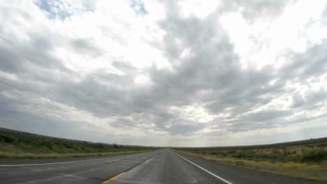 Point-of-view-accelerated-shot-of-driving-down-a-rural-Texas-highway